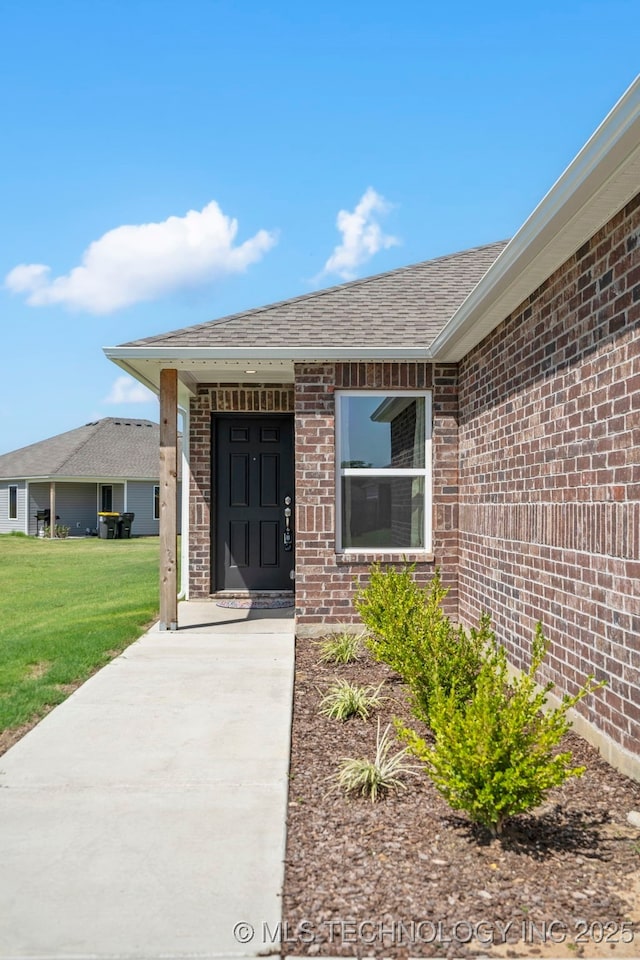 11608 S 274th E Pl, Coweta, OK 74429 - property entrance with brick siding, a shingled roof, and a lawn