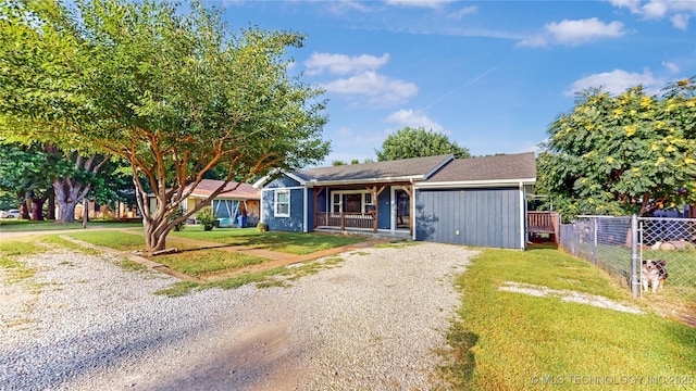 403 N Vine Ave, Cleveland, OK 74020 - ranch-style house with covered porch and driveway