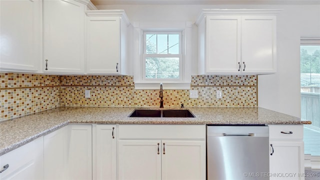 403 N Vine Ave, Cleveland, OK 74020 - kitchen with stainless steel dishwasher, white cabinetry, tasteful backsplash, and light stone counters