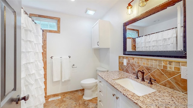 403 N Vine Ave, Cleveland, OK 74020 - full bathroom with backsplash, vanity, and a shower with shower curtain