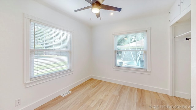 403 N Vine Ave, Cleveland, OK 74020 - empty room featuring healthy amount of natural light, light wood-style floors, a ceiling fan, and recessed lighting