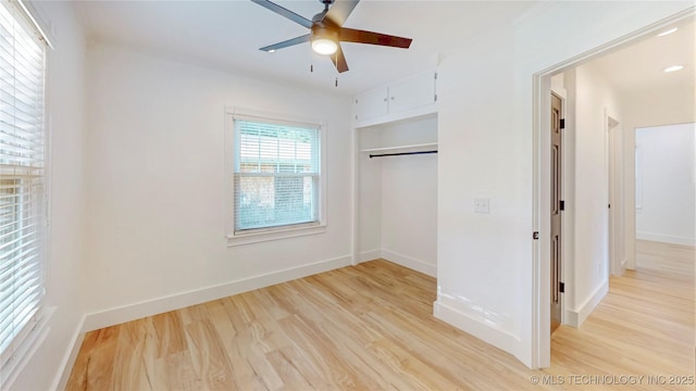 403 N Vine Ave, Cleveland, OK 74020 - unfurnished bedroom with light wood-type flooring, a closet, and a ceiling fan