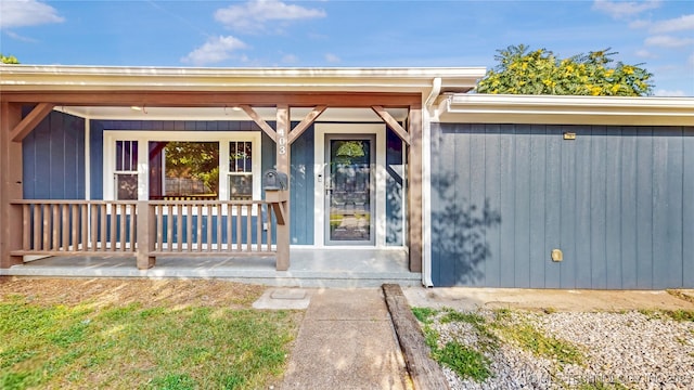 403 N Vine Ave, Cleveland, OK 74020 - doorway to property with covered porch