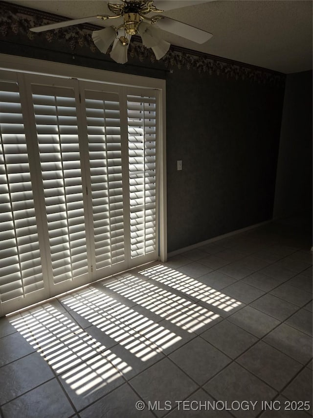 8302 E 84th St, Tulsa, OK 74133 - tiled spare room with ceiling fan
