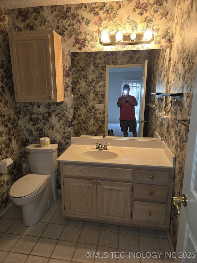 8302 E 84th St, Tulsa, OK 74133 - bathroom featuring tile patterned flooring, wallpapered walls, and vanity