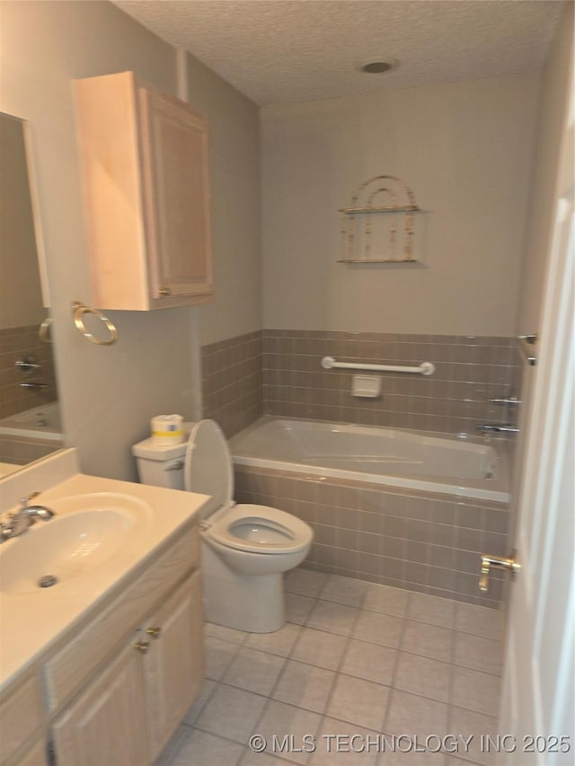 8302 E 84th St, Tulsa, OK 74133 - bathroom with a bath, tile patterned flooring, vanity, and a textured ceiling