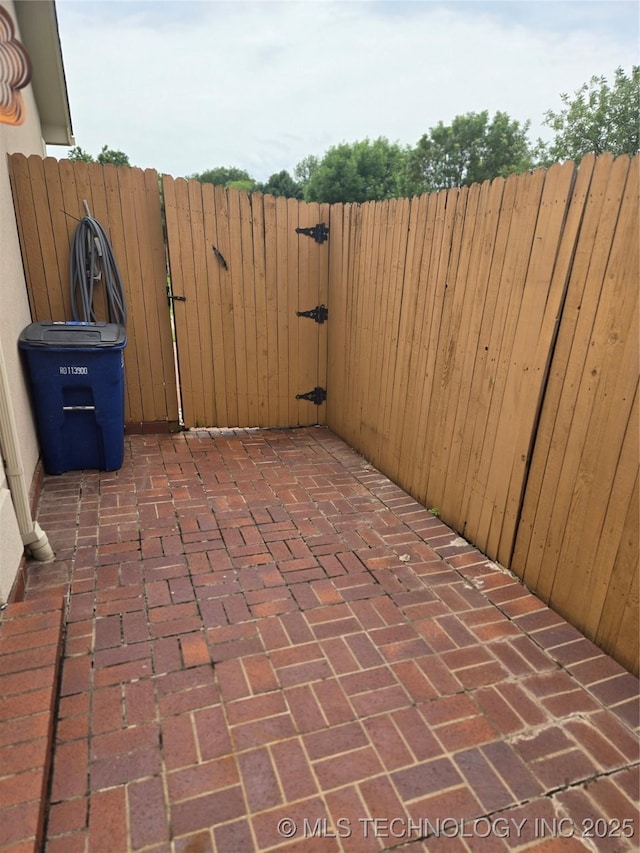 8302 E 84th St, Tulsa, OK 74133 - view of patio with a gate