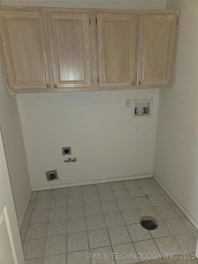 8302 E 84th St, Tulsa, OK 74133 - laundry area with cabinet space, electric dryer hookup, washer hookup, hookup for a gas dryer, and light tile patterned flooring