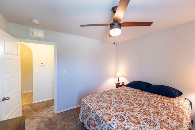 11105 N 145th E Pl, Owasso, OK 74055 - bedroom featuring carpet floors, arched walkways, and a ceiling fan