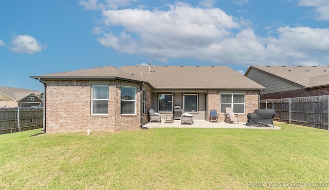 11105 N 145th E Pl, Owasso, OK 74055 - back of property featuring brick siding, a fenced backyard, and a patio area