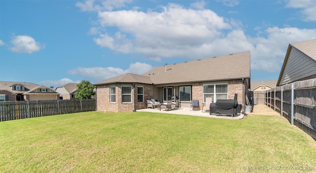 11105 N 145th E Pl, Owasso, OK 74055 - rear view of house featuring brick siding, a fenced backyard, and a patio area