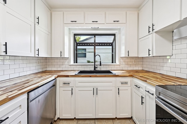 4643 E 59th St, Tulsa, OK 74135 - kitchen with wooden counters, stainless steel appliances, and white cabinets