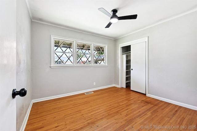 4643 E 59th St, Tulsa, OK 74135 - unfurnished bedroom featuring light wood-style floors, ornamental molding, a closet, and a ceiling fan