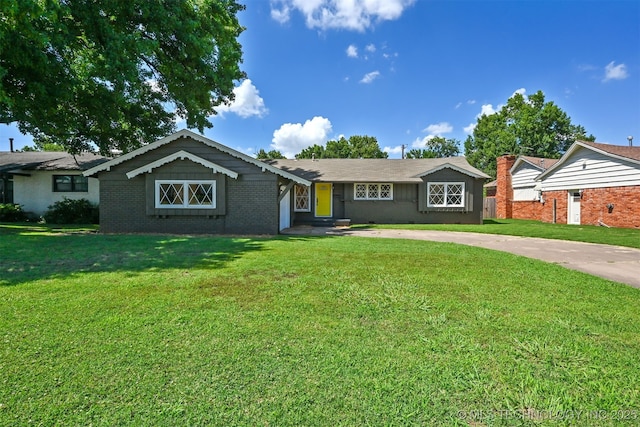 4643 E 59th St, Tulsa, OK 74135 - ranch-style house featuring driveway, a front lawn, and brick siding