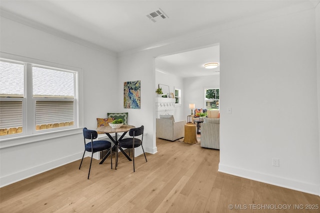 1524 N Main St, Tulsa, OK 74106 - dining room featuring light wood-style flooring and baseboards