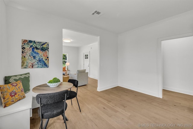 1524 N Main St, Tulsa, OK 74106 - dining area with light wood finished floors and baseboards