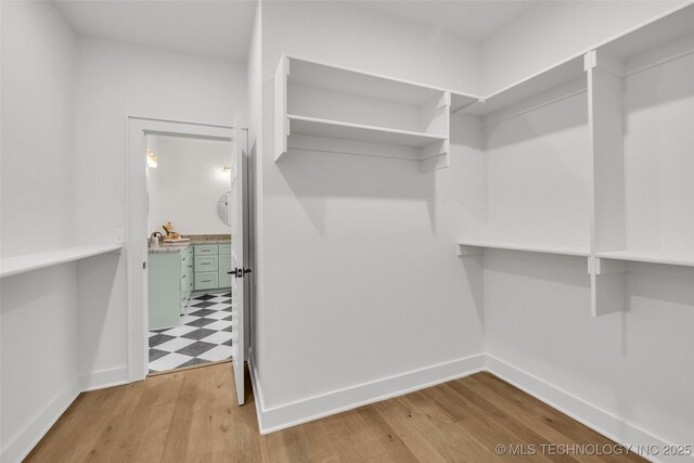 1524 N Main St, Tulsa, OK 74106 - spacious closet featuring wood finished floors