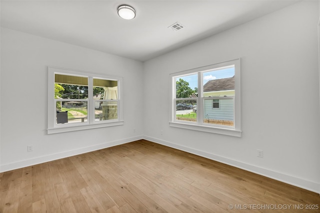 1524 N Main St, Tulsa, OK 74106 - unfurnished room featuring baseboards and hardwood / wood-style floors