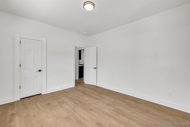 1524 N Main St, Tulsa, OK 74106 - unfurnished bedroom featuring light wood finished floors