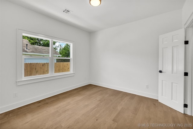 1524 N Main St, Tulsa, OK 74106 - empty room featuring wood finished floors and baseboards