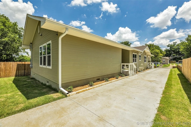 1524 N Main St, Tulsa, OK 74106 - view of side of home featuring driveway, crawl space, and a patio area
