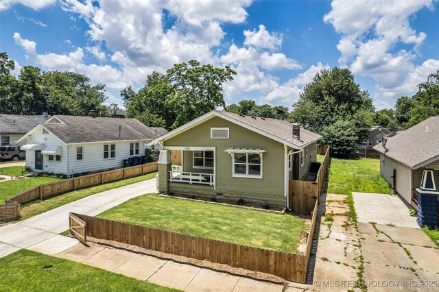 1524 N Main St, Tulsa, OK 74106 - view of front facade featuring a porch, crawl space, concrete driveway, and a gate