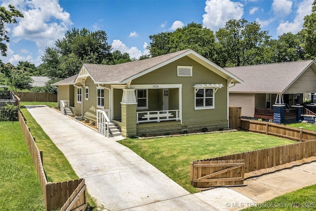 1524 N Main St, Tulsa, OK 74106 - bungalow featuring covered porch, a shingled roof, and concrete driveway