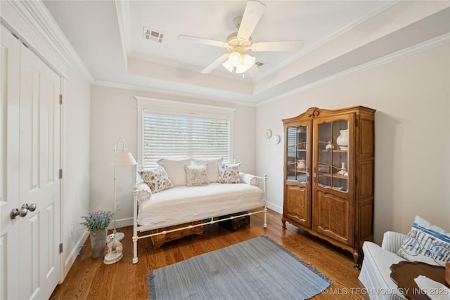 8002 E Galveston Pl, Broken Arrow, OK 74014 - living area with a tray ceiling, wood finished floors, a ceiling fan, and crown molding