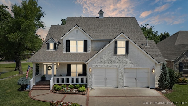 8002 E Galveston Pl, Broken Arrow, OK 74014 - traditional-style house with roof with shingles, a porch, concrete driveway, a front lawn, and brick siding