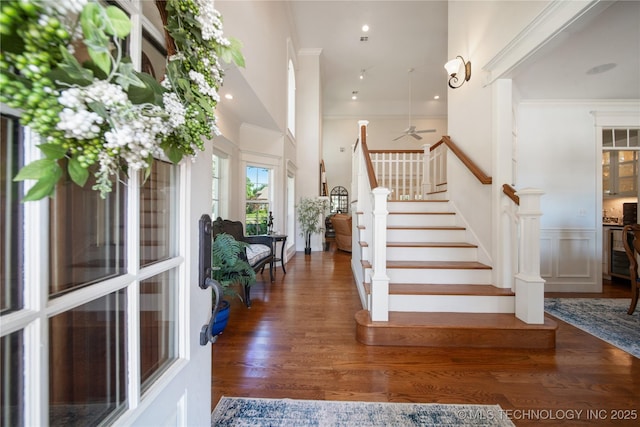 8002 E Galveston Pl, Broken Arrow, OK 74014 - staircase with wood finished floors, ceiling fan, ornamental molding, and a wainscoted wall