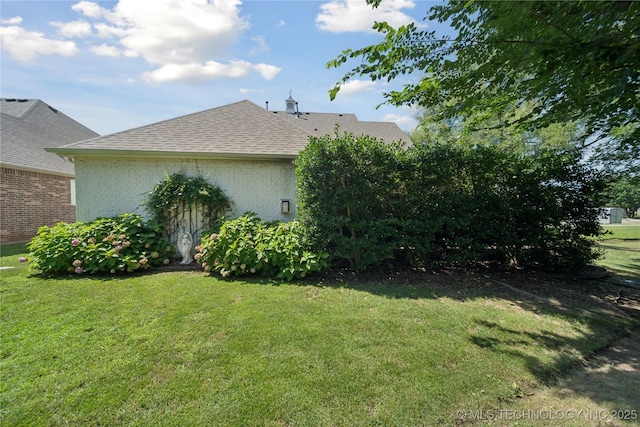 8002 E Galveston Pl, Broken Arrow, OK 74014 - view of home's exterior with a yard, brick siding, and roof with shingles