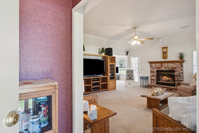 5621 E Hunter Ln, Claremore, OK 74019 - carpeted living room with a ceiling fan and a fireplace