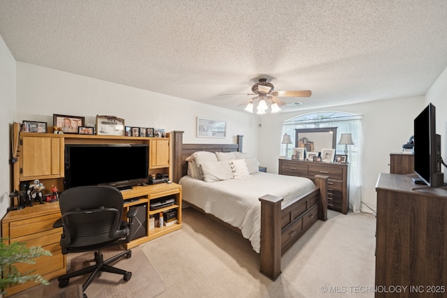 5621 E Hunter Ln, Claremore, OK 74019 - bedroom featuring light carpet, a desk, a textured ceiling, and ceiling fan