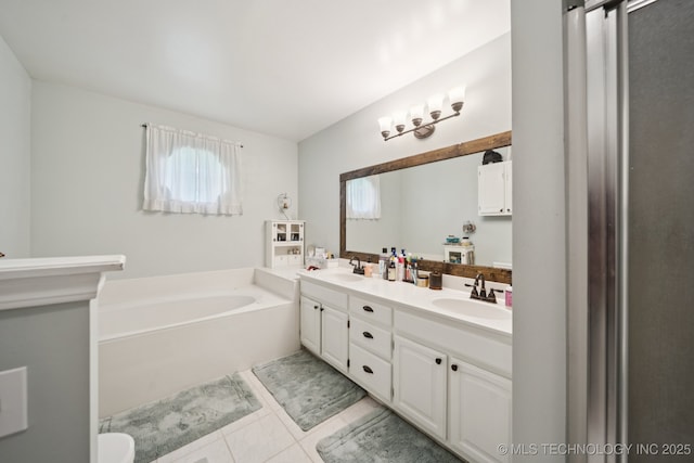5621 E Hunter Ln, Claremore, OK 74019 - full bathroom featuring a garden tub, double vanity, and tile patterned floors