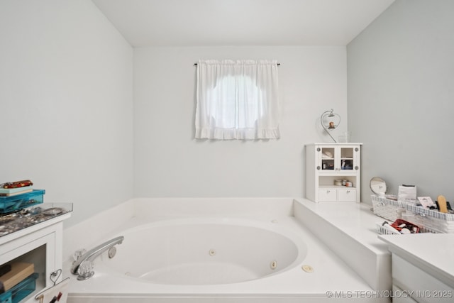 5621 E Hunter Ln, Claremore, OK 74019 - bathroom with vanity and a tub with jets