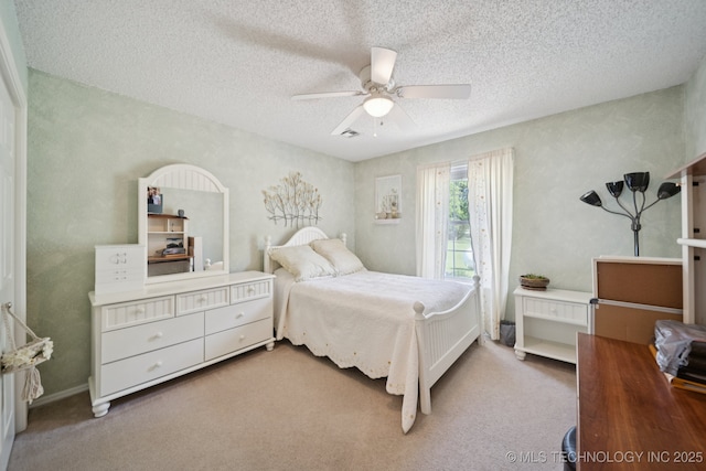 5621 E Hunter Ln, Claremore, OK 74019 - carpeted bedroom featuring ceiling fan and a textured ceiling