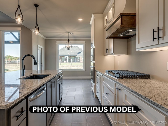 7010 E 137th St, Collinsville, OK 74021 - kitchen featuring appliances with stainless steel finishes, custom range hood, white cabinetry, light tile patterned floors, and crown molding