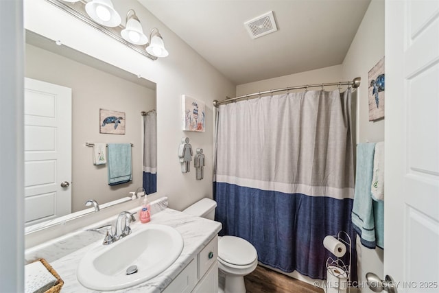 1111 W Cheyenne Ln, Claremore, OK 74019 - bathroom featuring vanity, wood finished floors, and a shower with curtain