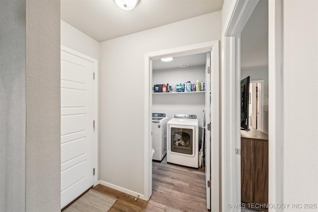 1111 W Cheyenne Ln, Claremore, OK 74019 - washroom with wood finished floors and independent washer and dryer