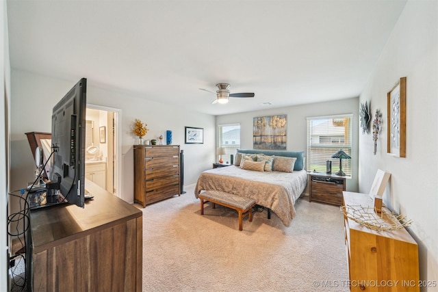 1111 W Cheyenne Ln, Claremore, OK 74019 - bedroom featuring light colored carpet, ensuite bathroom, and ceiling fan