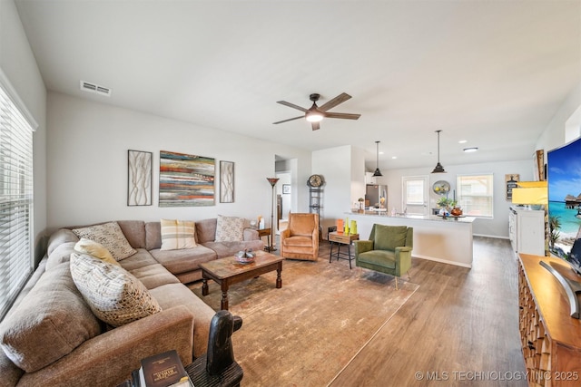 1111 W Cheyenne Ln, Claremore, OK 74019 - living room featuring wood finished floors, a ceiling fan, and recessed lighting