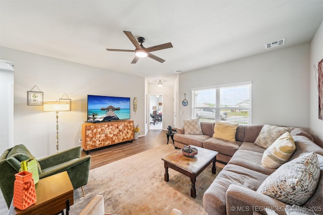 1111 W Cheyenne Ln, Claremore, OK 74019 - living area with wood finished floors and ceiling fan