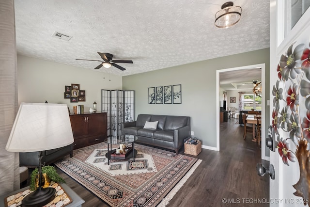 1120 S Sequoyah Dr, Oologah, OK 74053 - living area with a ceiling fan, wood finished floors, and a textured ceiling