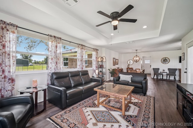 1120 S Sequoyah Dr, Oologah, OK 74053 - living area with a raised ceiling, wood finished floors, a ceiling fan, healthy amount of natural light, and recessed lighting
