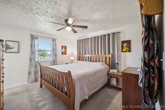 1120 S Sequoyah Dr, Oologah, OK 74053 - carpeted bedroom featuring a textured ceiling and a ceiling fan