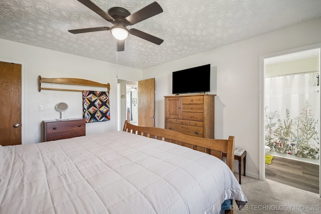 1120 S Sequoyah Dr, Oologah, OK 74053 - bedroom featuring a textured ceiling, carpet, a ceiling fan, and connected bathroom
