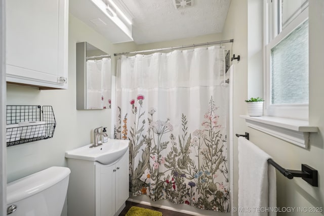 1120 S Sequoyah Dr, Oologah, OK 74053 - full bathroom with vanity, curtained shower, and a textured ceiling