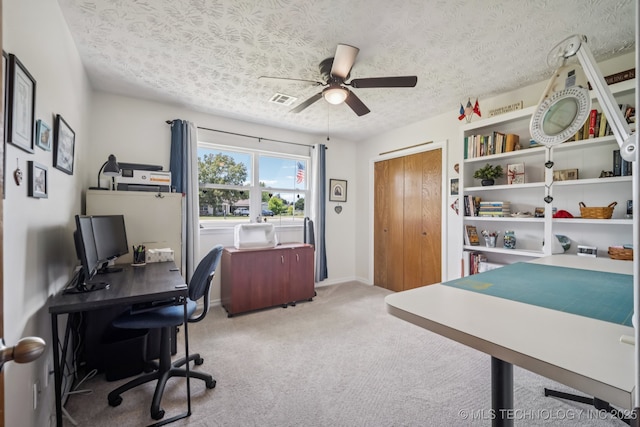 1120 S Sequoyah Dr, Oologah, OK 74053 - home office with ceiling fan, a textured ceiling, and carpet