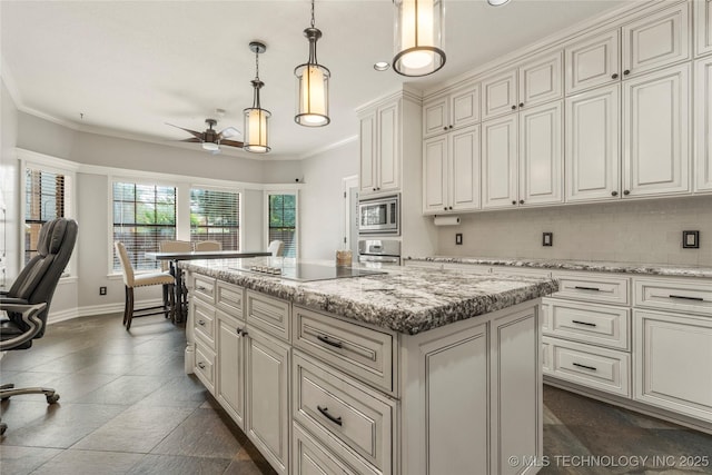 5428 E 88th St, Tulsa, OK 74137 - kitchen with black electric cooktop, ceiling fan, a kitchen island, stainless steel microwave, and pendant lighting