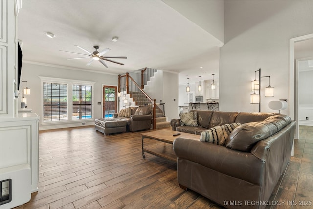 5428 E 88th St, Tulsa, OK 74137 - living area featuring ceiling fan, stairs, dark wood-style flooring, and crown molding